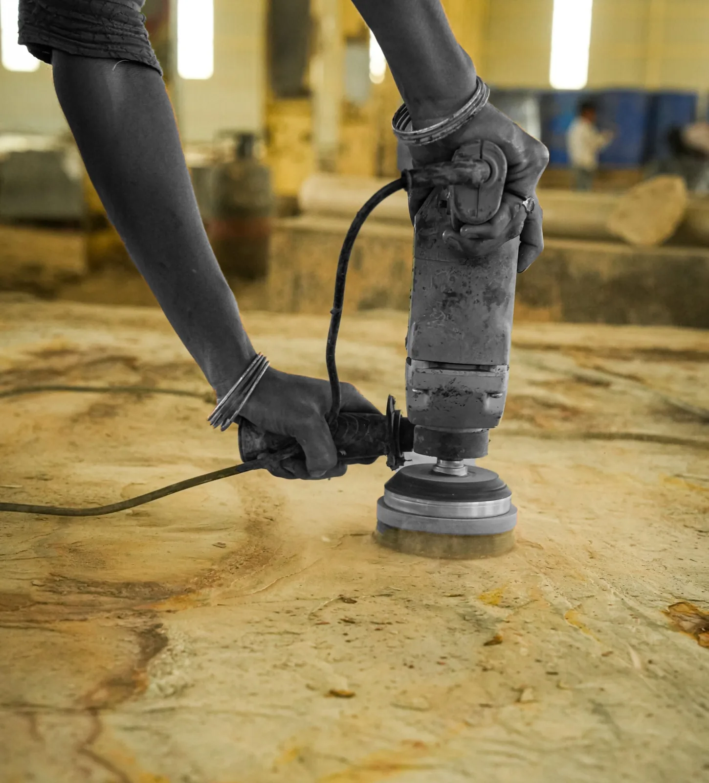 Worker finishing a natural stone surface